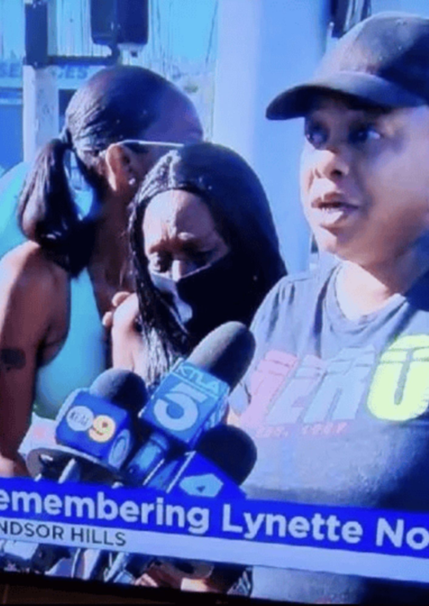 Attorney Jasmine Mines with a family speaking to reporters