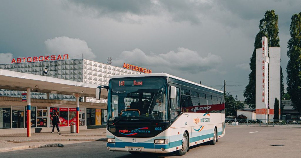 City bus parked at a modern bus station
