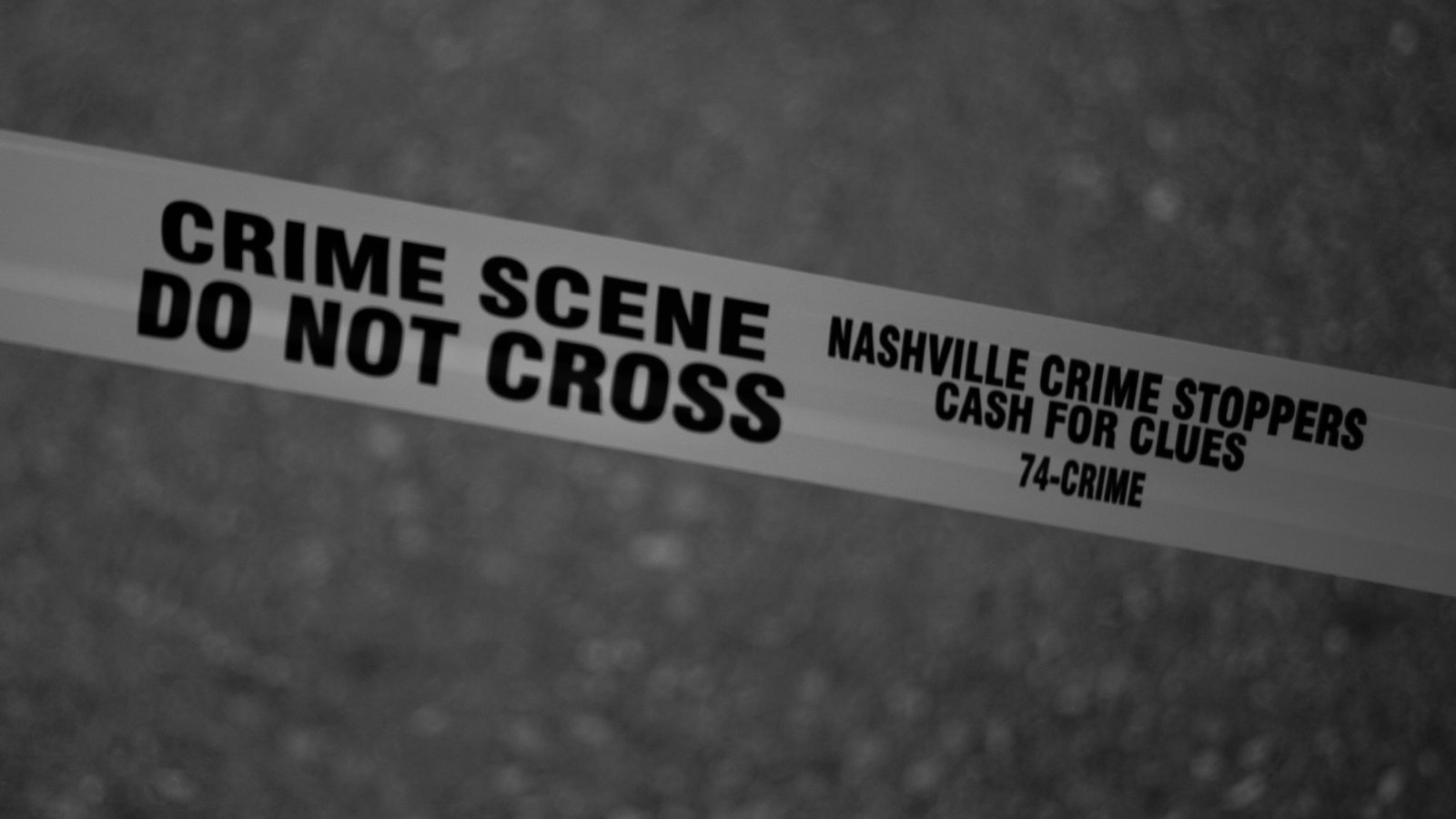 Yellow crime scene tape reading do not cross