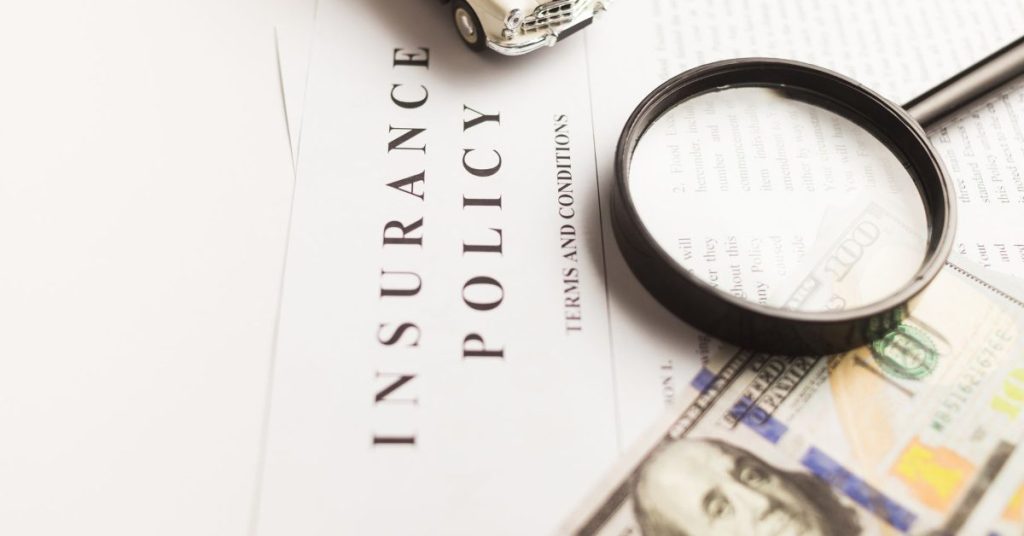 Insurance policy document with magnifying glass