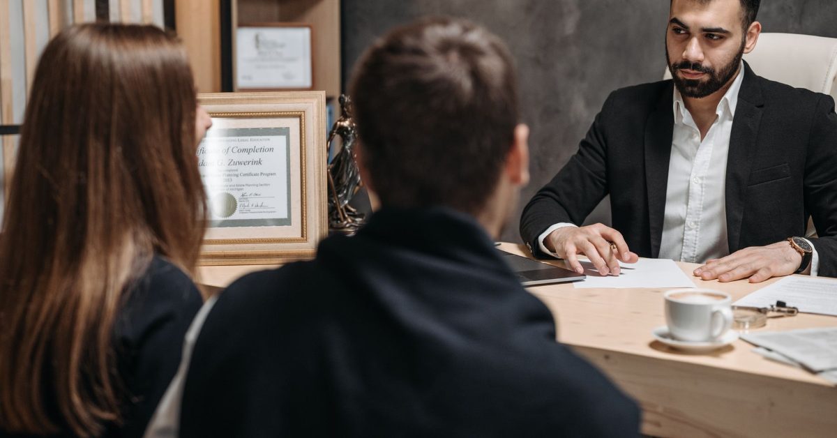 Lawyer meeting with clients in an office