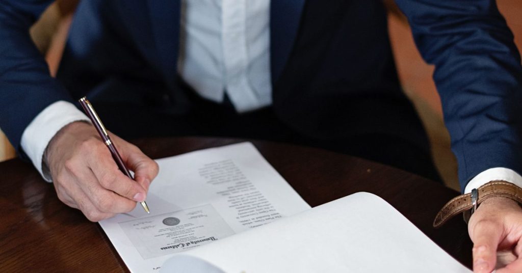 Person signing a settlement document
