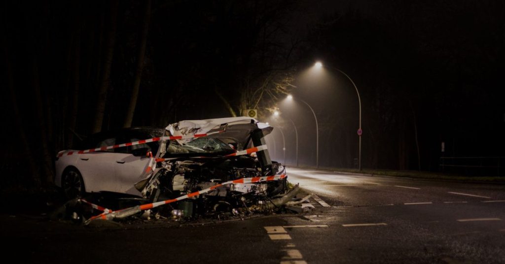 Wrecked car after a crash on a dark street