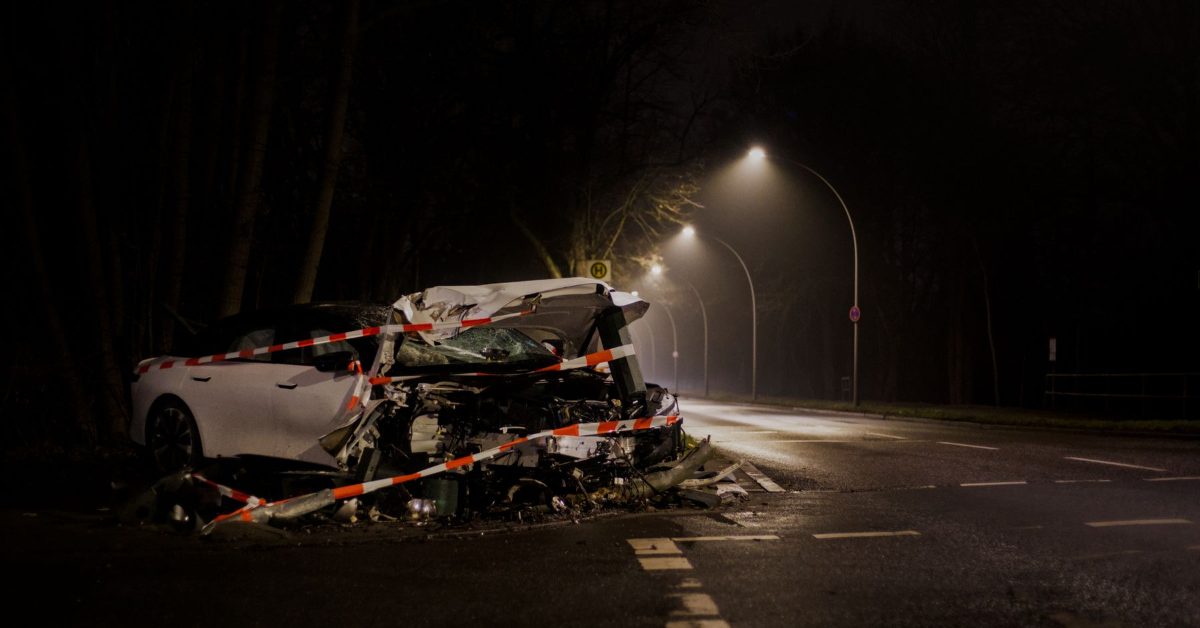Wrecked car after a crash on a dark street